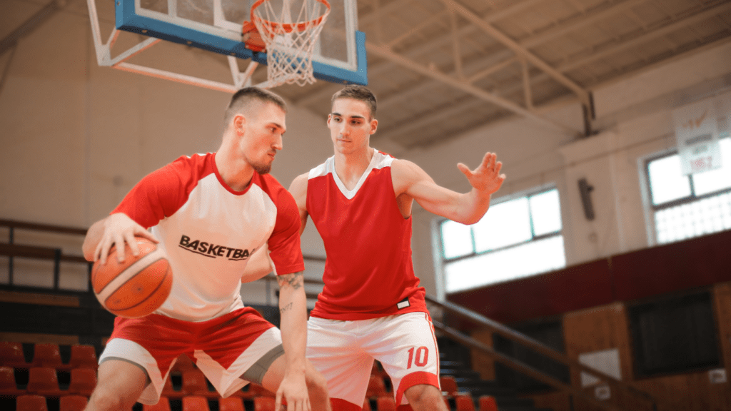 Two men playing basketball